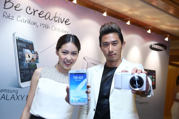 Samsung celebrity ambassadors, Olivia Ong and Desmond Tan with their newly launched devices – GALAXY Note II and GALAXY Camera at the ‘Be Creative’ event